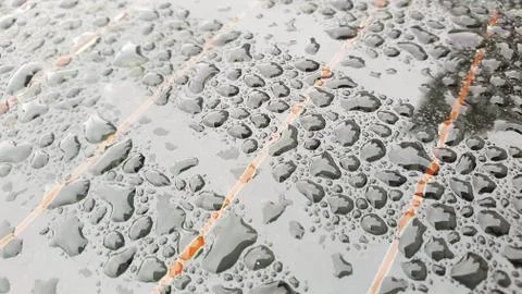 Rain drops on window glasses surface with cloudy background Stock Photos