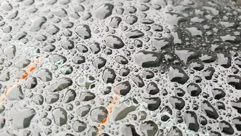 Rain drops on window glasses surface with cloudy background Foto stock