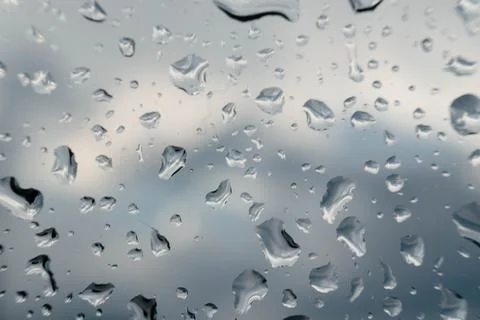 Rain drops on window glasses surface with cloudy background . Natural Patte.. Фото