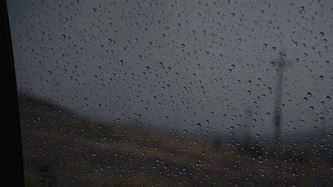 Rain drops on the window with mountain in background Stock Footage 88307772