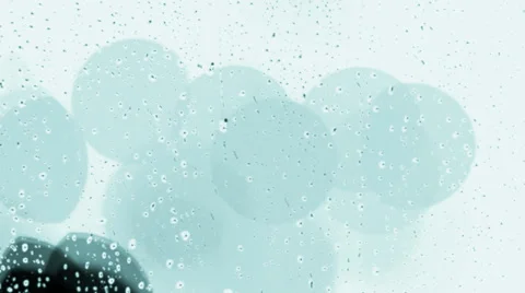 Rain drops on window with moving traffic light Stock Footage 35712227