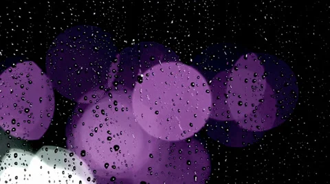 Rain drops on window with moving traffic light Video stock 35712797