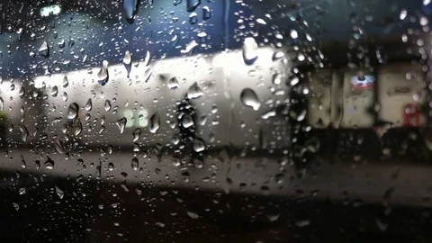 Rain drops on the window of a moving train Video stock 76369262