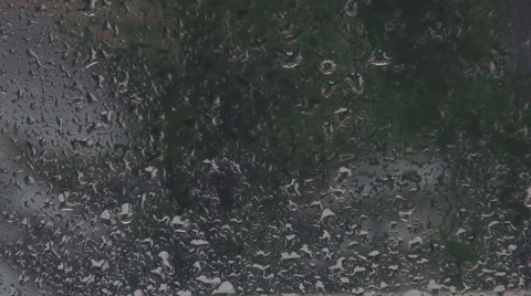 Rain drops on window, night outdoor, rain droplets draining rainy weather season Stock Footage 42646712