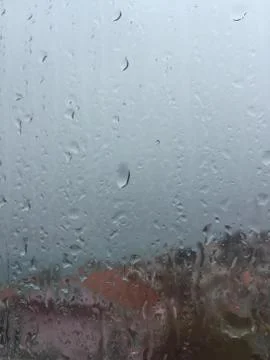 Rain drops on window Stock Photos