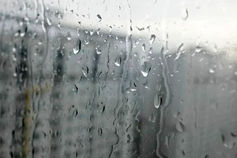Rain drops at a window Stock Photos