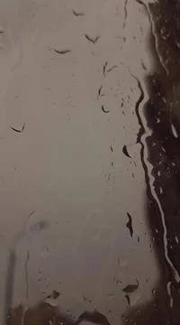 Rain drops on a window Stock Photos