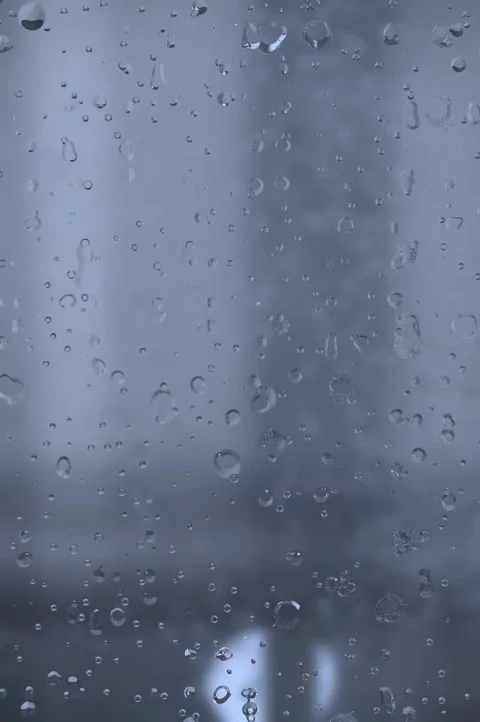Rain drops on window. Rain drops and lights. wet glass window. rain background.  Stock Footage 302558692