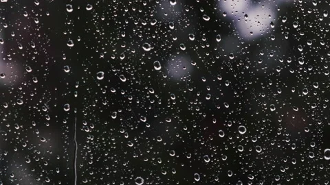 Rain drops on the window surface Stock Footage 144927373