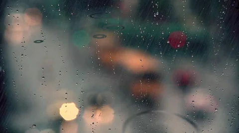 Rain drops on window with traffic in background ,rainy weather, Stock Footage 53992931