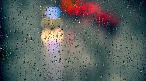 Rain drops on window with traffic in background ,rainy weather, Stock Footage 53997559