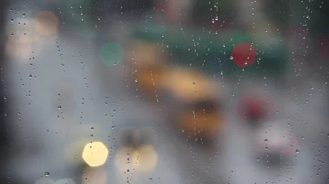 Rain drops on window with traffic in background ,rainy weather, Stock Footage 54008007
