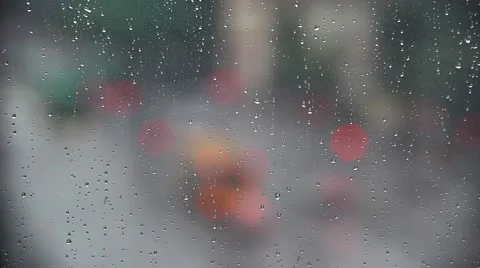 Rain drops on window with traffic in background ,rainy weather, Stock Footage 54008984