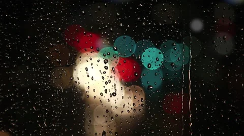 Rain drops on window with traffic bokeh Stock Footage 40005701