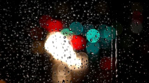 Rain drops on the window with traffic light Stock Footage 69845649