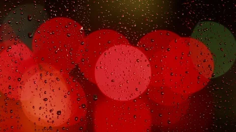 Rain drops on the window with traffic light Video stock 69845970