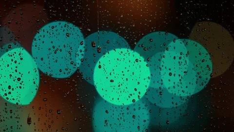 Rain drops on the window with traffic light Video stock 69846053