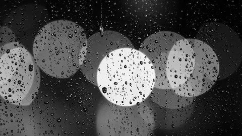 Rain drops on the window with traffic light Video stock 69846214