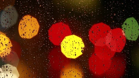 Rain drops on the window with traffic light Video stock 69849702