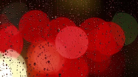Rain drops on the window with traffic light Video stock 69850005