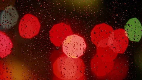 Rain drops on the window with traffic light Video stock 69850122