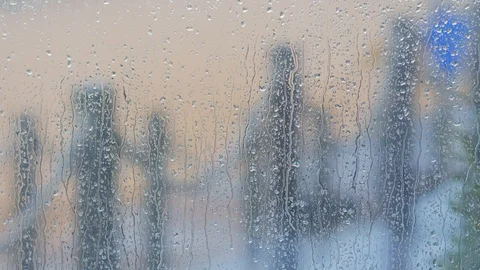 Rain drops on the window, walkway on the beach Stock Footage 121106306