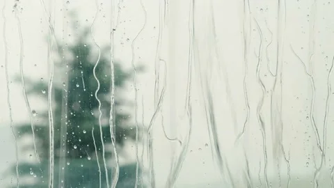 Rain drops on windows glass. Summer shower, close up Stock Footage 133338057