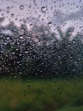 Rain drops on the windshield of the car Stock Photos