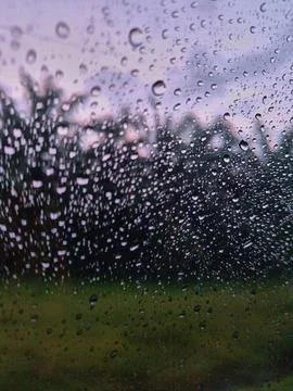 Rain drops on the windshield of the car Stock Photos