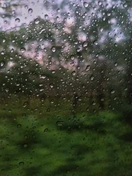 Rain drops on the windshield of the car Stock Photos
