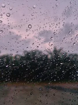 Rain drops on the windshield of the car Stock Photos