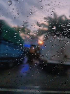 Rain drops on the windshield of the car Stock Photos
