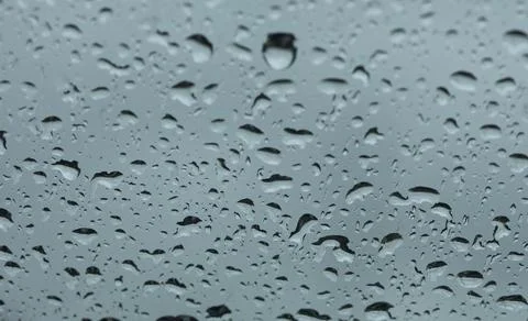 Rain drops on windshield Stock Photos