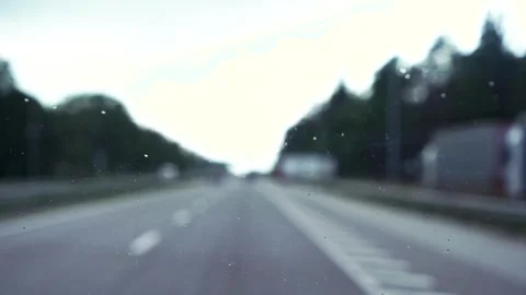 Rain drops on the windshield. windshield wiper operation Stock Footage 245092152