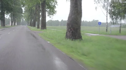 Rain fall on car automobile windscreen drive on road Stock Footage 49225077