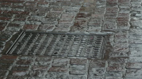 Rain that fall on a manhole Stock Footage 130344322