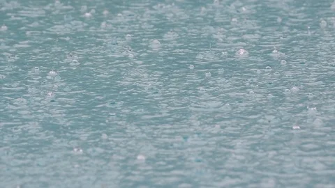 Rain fall at swimming pool slow motion Stock Footage 128226353