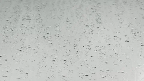 Rain Falling Against Window Glass Close Up Stock Footage 345685094