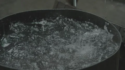 Rain falling into a barrel Stock Footage 244397477