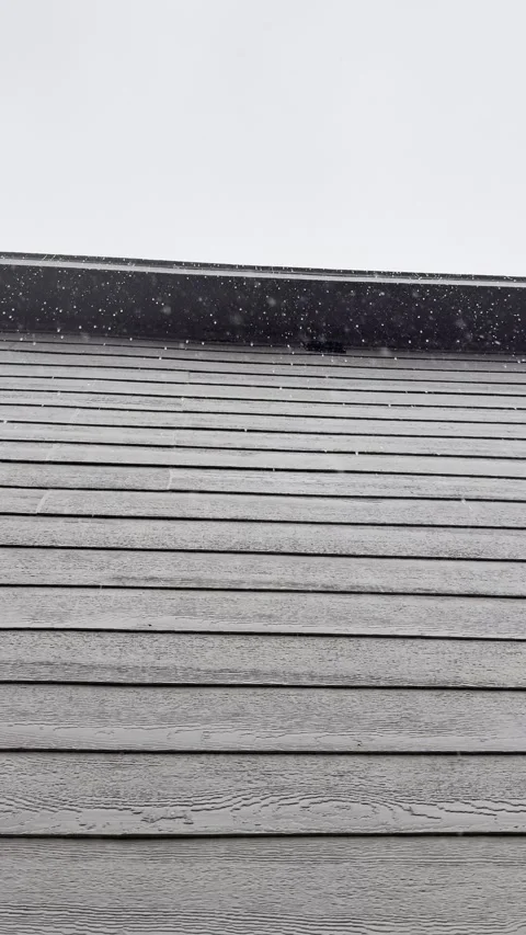 Rain Falling Beside House Siding and Roof Edge Video stock 344779353