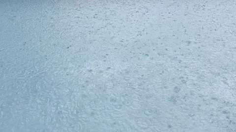 Rain Falling Into Blue Pool Water, Heavy Thunderstorm, Miami, 4K Stock Footage 341367162