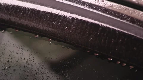 Rain falling on the car, rain drops on the car side window hood, rain falling 스톡 동영상 289437981