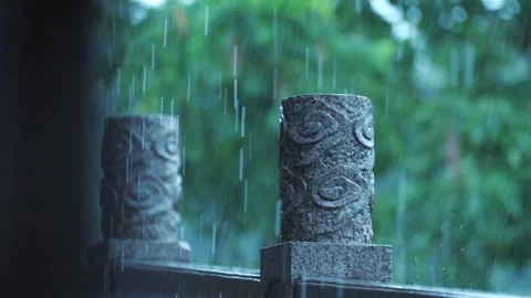 Rain falling on carved stone baluster in classical Suzhou garden Stock Footage 345655362
