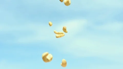 Rain of falling cashews from the sky slow motion Vidéo 107685540