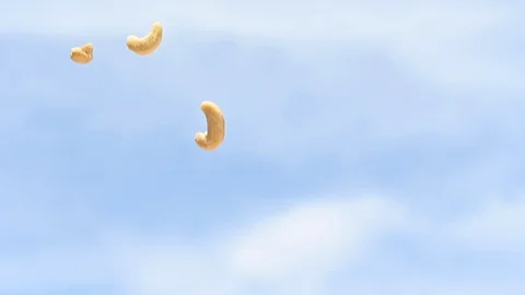 Rain of falling cashews from the sky slow motion Stock Footage 107838163