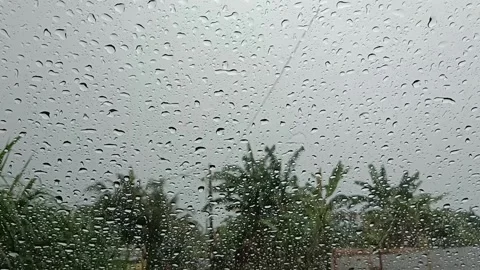 Rain is falling. cloudy view. with drops in the car Stock Footage 233672913