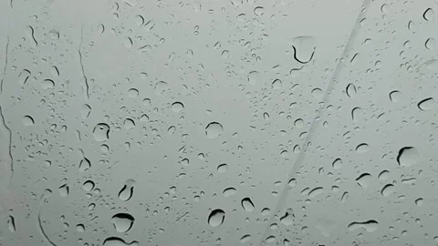 Rain is falling. cloudy view. with drops in the car Stock Footage 233672950