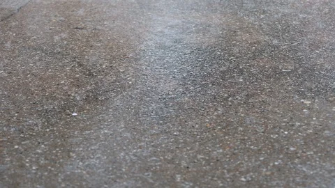 Rain falling on concrete Stock Footage 93948832