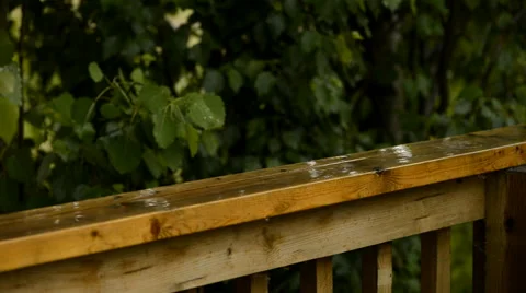 Rain falling on deck railing Stock Footage 51139823