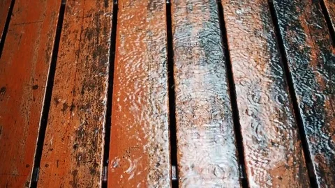 Rain falling on dirty wooden board floor, top perspective Stock Footage 80310448